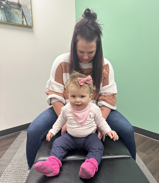 Chiropractor Elkhorn MN Amy Mick With Baby
